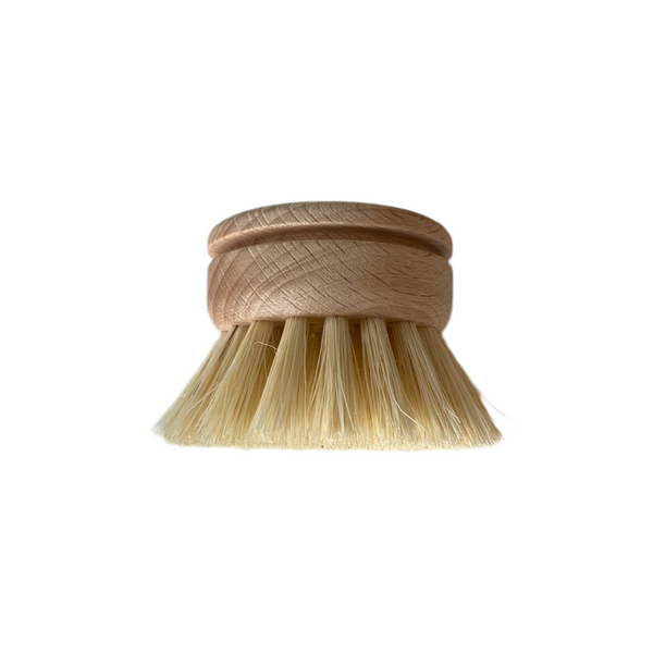 Replacement dish brush head with durable plant-based bristles and wooden base for eco-friendly dishwashing.