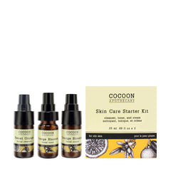 Starter kit for oily to combination skin by Cocoon Apothecary with sweet orange gel cleanser, orange blossom facial toner, and cream in travel-sized bottles alongside product box